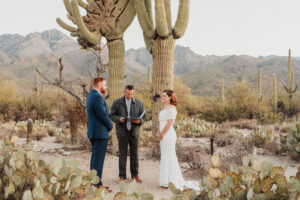 Groom looking lovingly at bride as they exchange vows at Sabino Canyon