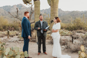 Groom looking lovingly at bride as they exchange vows at Sabino Canyon