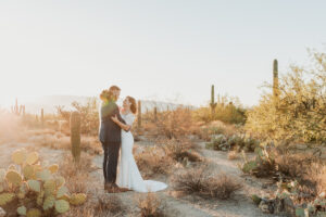 Bride smiling at groom in soft morning light at Sabino Canyon.