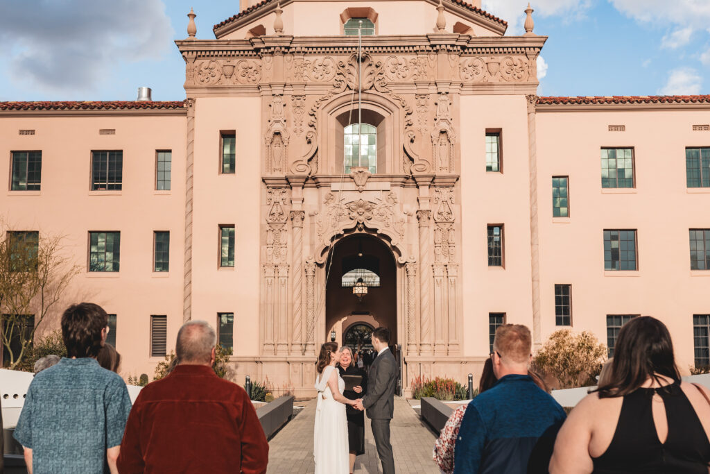 bride and groom ceremony with guests at pima county historic courthouse in tucson arizona