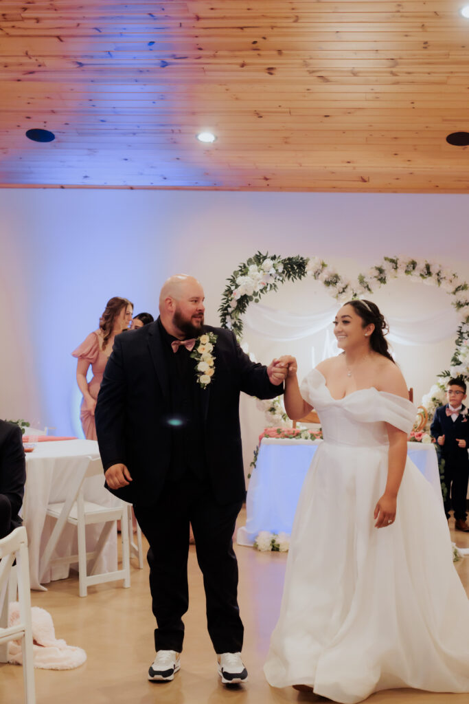 bride and groom getting ready for first dance at wedding