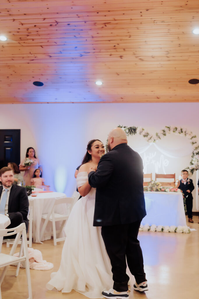 bride and groom during first dance at rhino ridge wedding venue in willcox arizona
