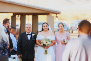 Bride walking down the aisle at a Willcox wedding venue