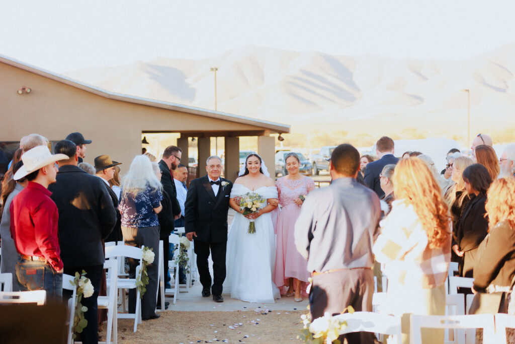 bride walking up aisle at wedding ceremony in arizona