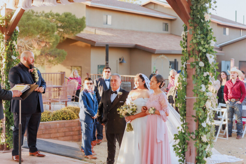 brides parents giving her to the groom at rhino ridge wedding venue