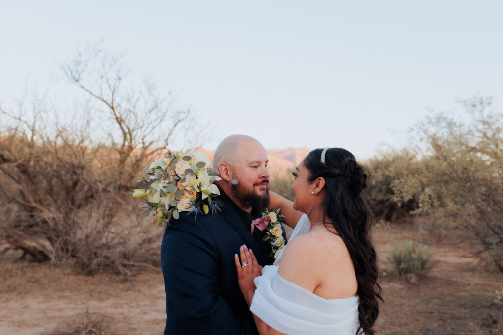 bride and groom looking at each other during bridal portraits in willcox arizona