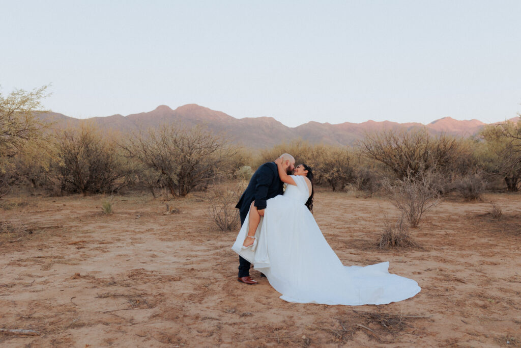 groom dipping bride in willcox arizona