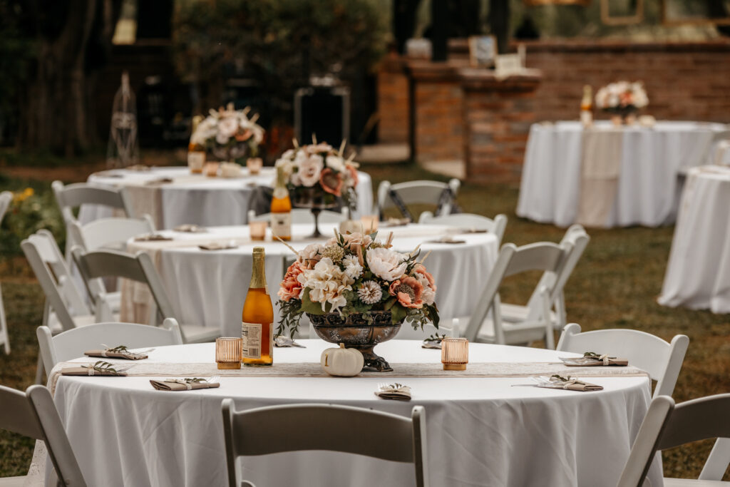 wedding reception setup with tables and florals at agua linda farm wedding venue in amado arizona