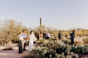 The bride and groom sharing an intimate moment during their Sabino Canyon elopement ceremony following their preparations at Westin La Paloma.