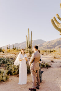 The bride and groom share their first kiss as a married couple during their elopement ceremony at Sabino Canyon, Tucson, Arizona.