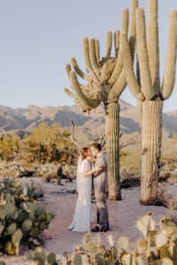 bride and groom have their first kiss together after the ceremony