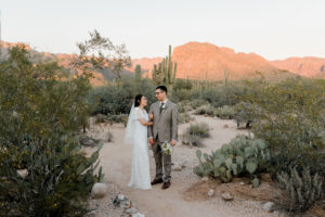 The couple shares a quiet moment together in the desert.