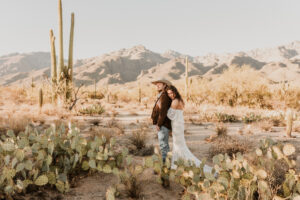 Bride and groom standing together in the Arizona desert