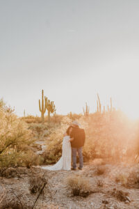 bride leaning on groom during golden hour at sabino canyon in tucson arizona