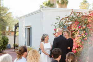 Bride and groom standing together during the ceremony