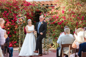 Couple embracing during their Urban Grove wedding