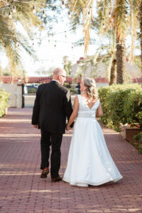 bride and groom walking away from ceremony spot after ceremony