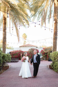 bride and groom walk together during portrait session in tucson arizona