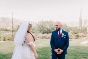 Groom smiling at the bride during their Tucson desert first look
