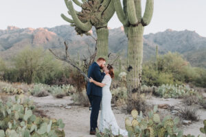 couple first kiss in the desert for their elopement in tucson